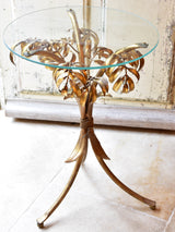 Small round Hans Kögl table with gold palm frond stand