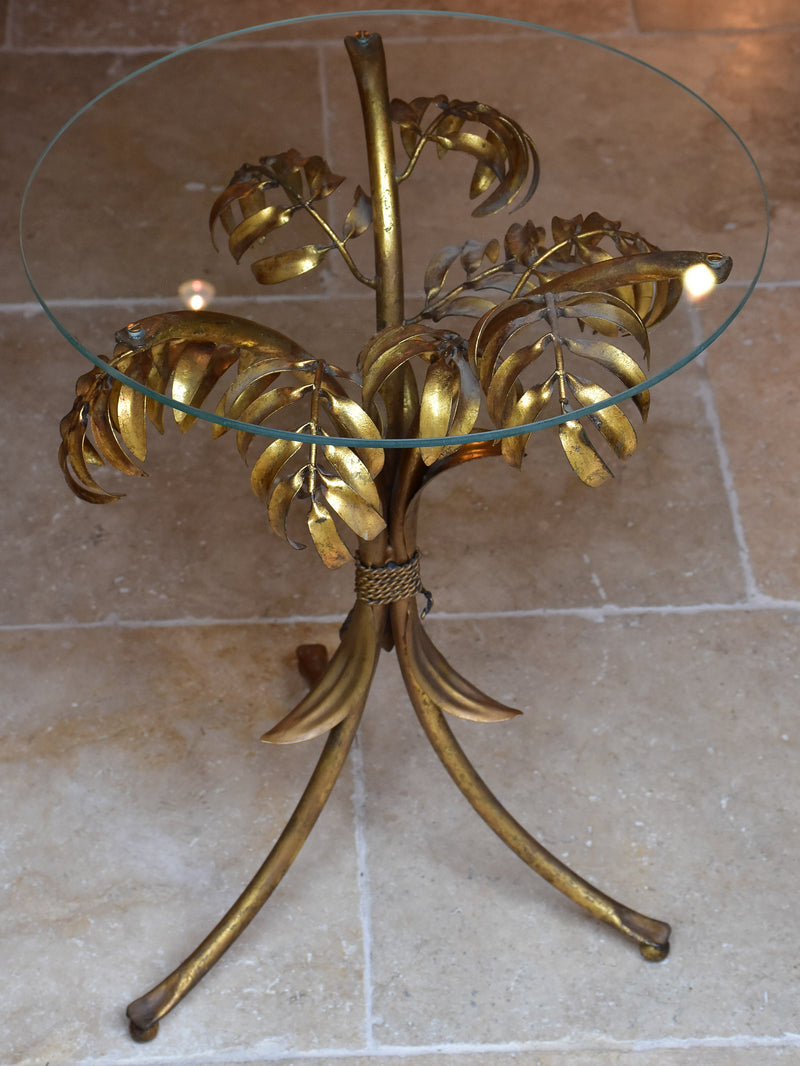 Small round Hans Kögl table with gold palm frond stand