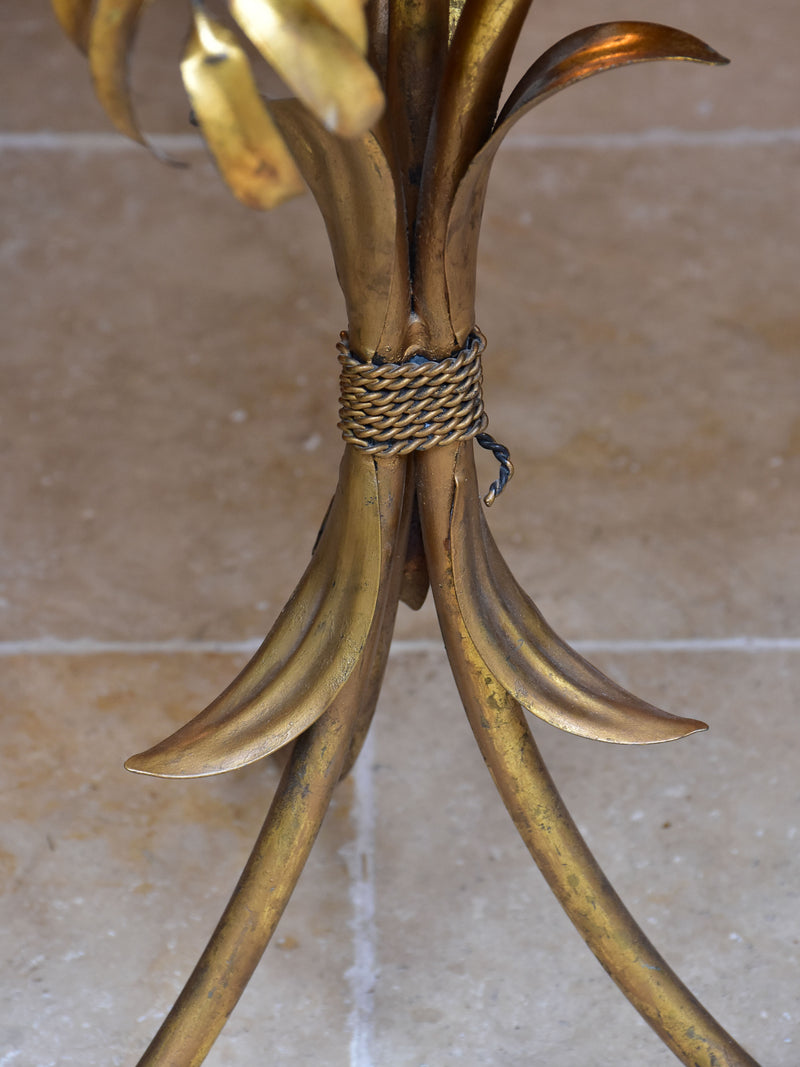Small round Hans Kögl table with gold palm frond stand