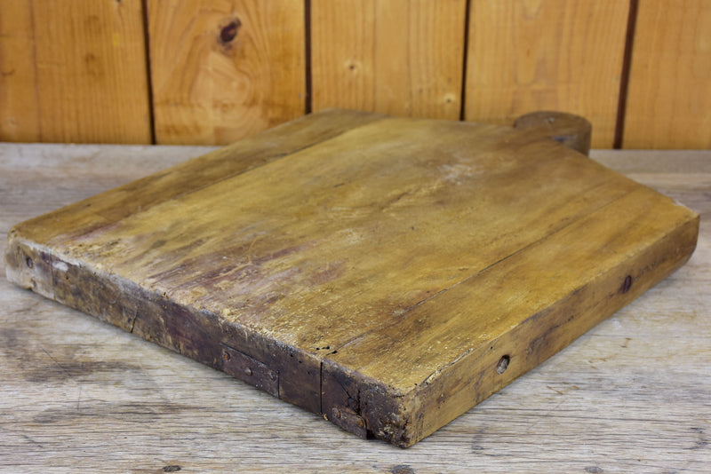 Antique French cutting board in the shape of a coat hanger