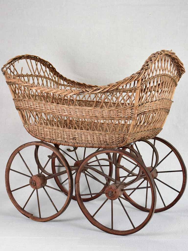 Vintage wicker and iron baby carriage