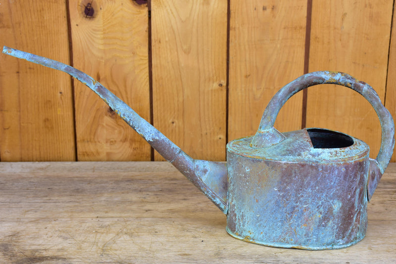 Small zinc watering can with long spout and blue patina