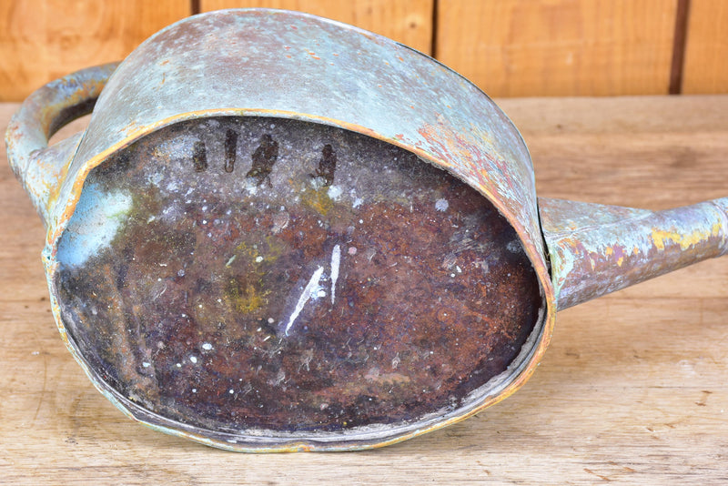 Small zinc watering can with long spout and blue patina