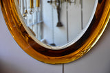 Vintage oval Metalvetro mirror with amber frame