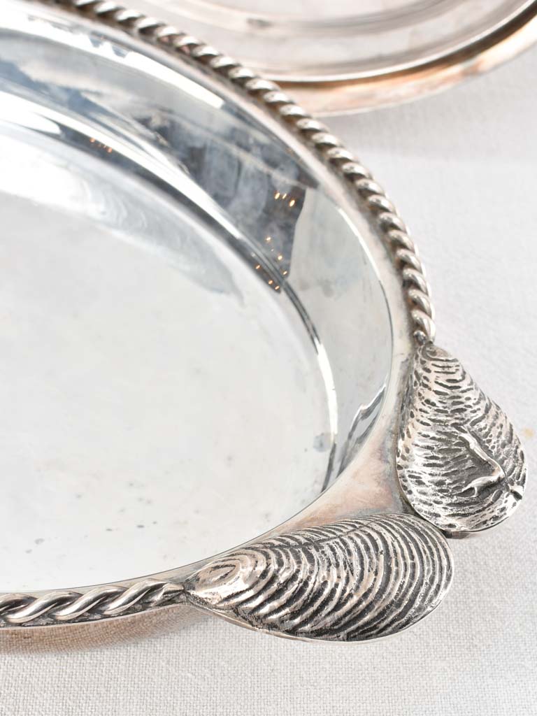 Two silver plate seafood presentation platters