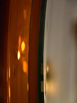 Vintage oval Metalvetro mirror with amber frame