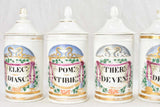 Colourfully labeled apothecary jars