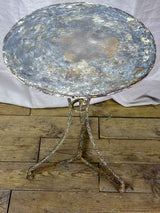 Antique French bistro table with timeworn beige patina