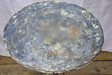 Antique French bistro table with timeworn beige patina