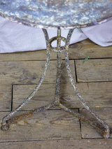 Antique French bistro table with timeworn beige patina