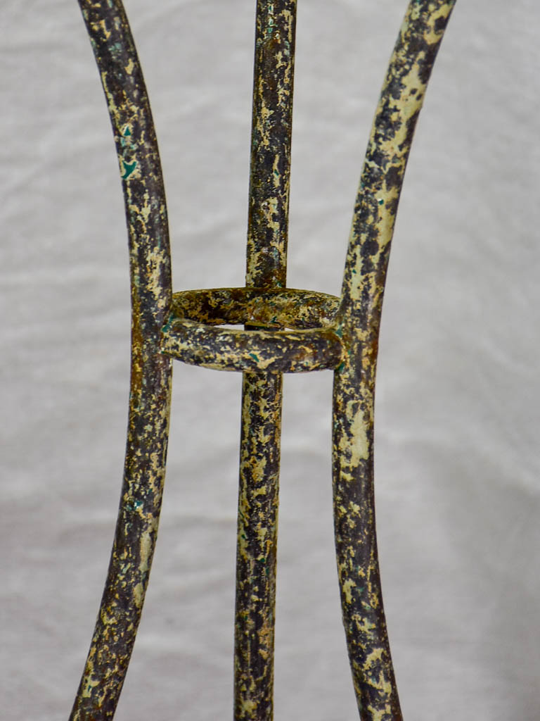 Antique French bistro table with timeworn beige patina