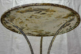 Antique French bistro table with timeworn beige patina