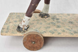 Antique horse pull toy with charm