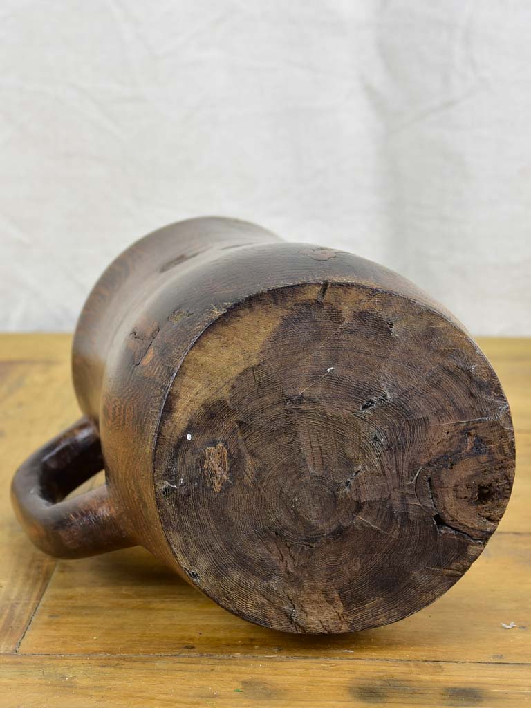 Primitive carved wooden pitcher