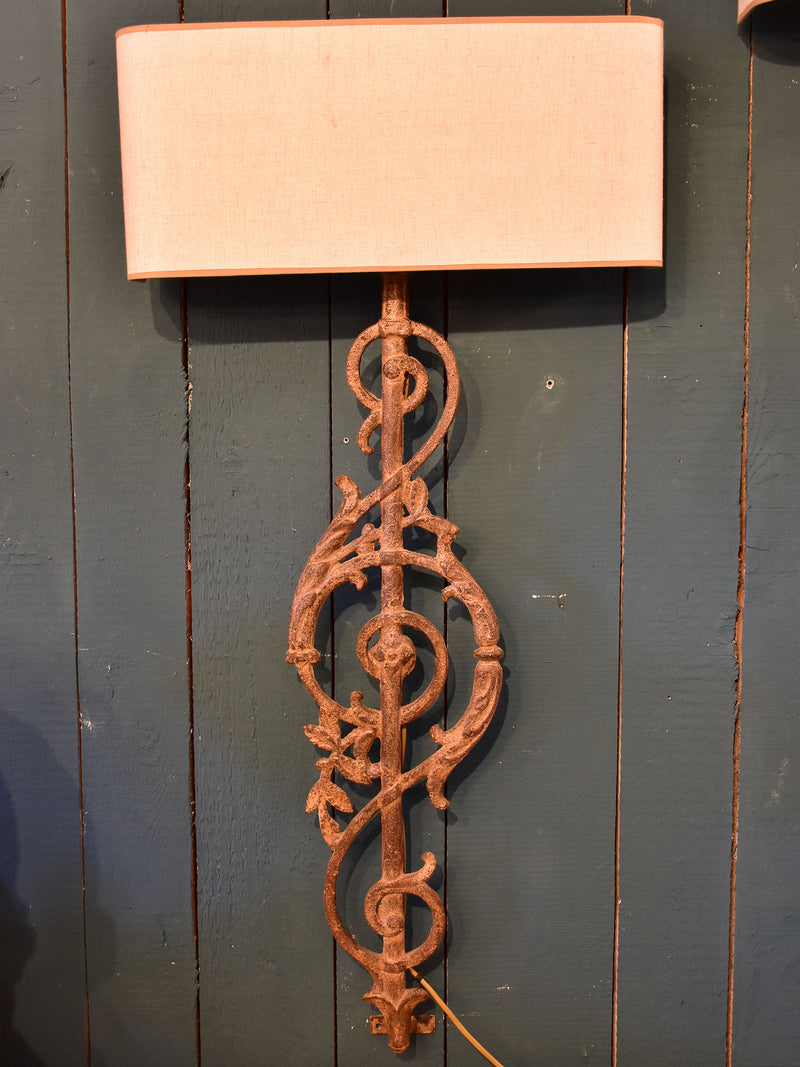Pair of wall sconces made from salvaged iron from a balcony