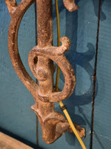 Pair of wall sconces made from salvaged iron from a balcony
