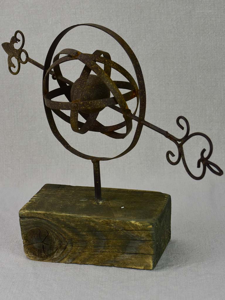 Rustic Armillary sphere mounted on a wooden block