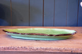 Two green glazed French platters from Dieulefit