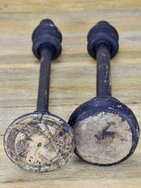 Two hat stands with black patina