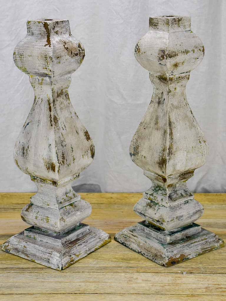 Pair of salvaged wooden decorative elements / candlesticks with grey patina