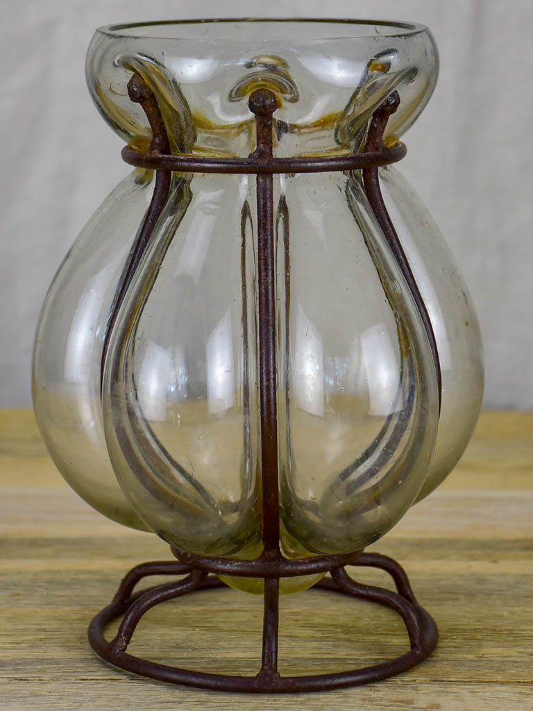 Blown glass vase in metal frame