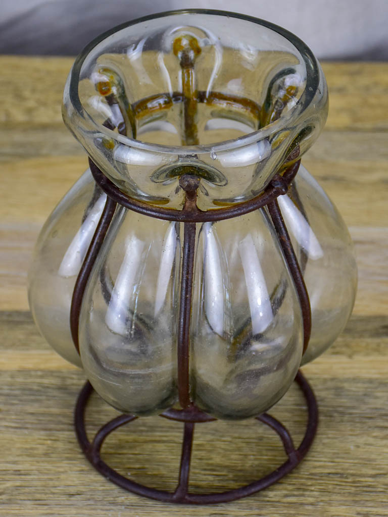 Blown glass vase in metal frame