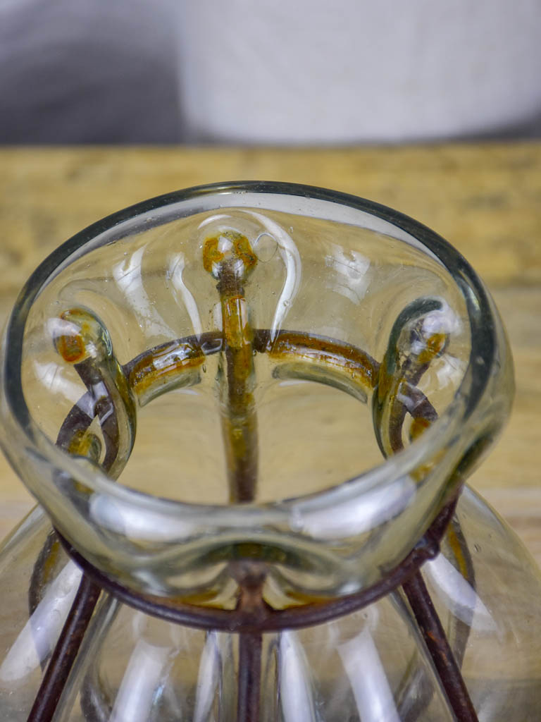 Blown glass vase in metal frame