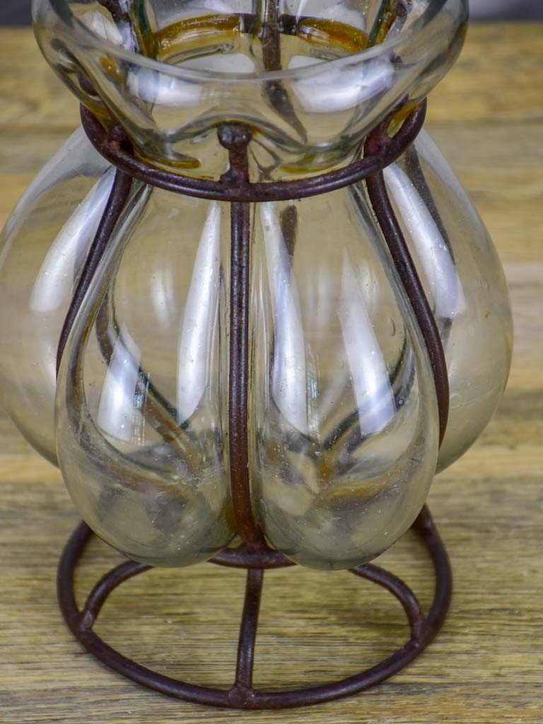Blown glass vase in metal frame