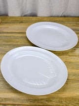 Pair of antique French oval platters with basin for jus