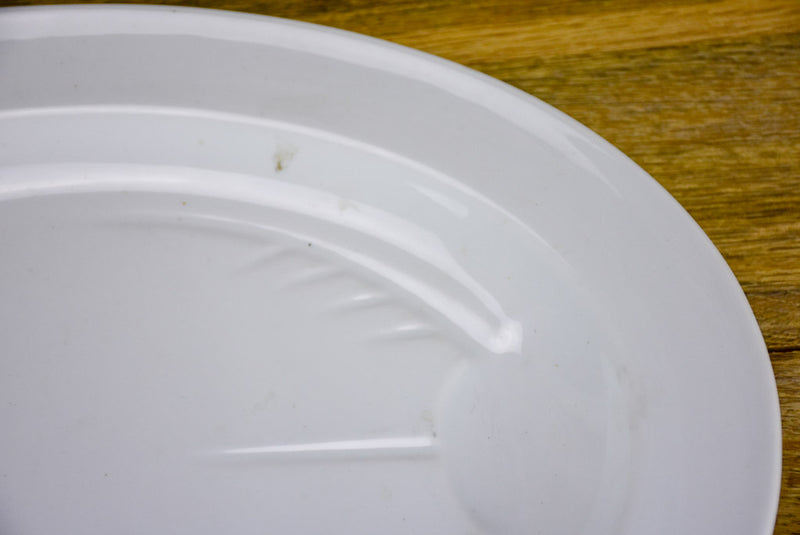 Pair of antique French oval platters with basin for jus
