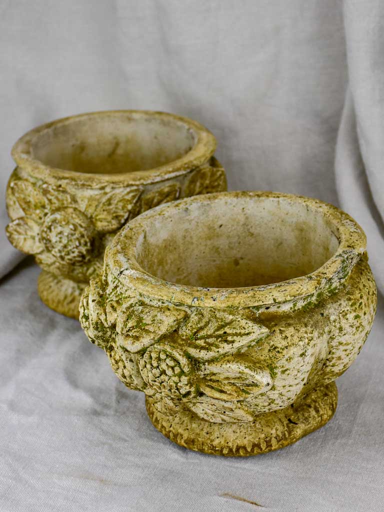Pair of concrete flower pots decorated with pomegranates