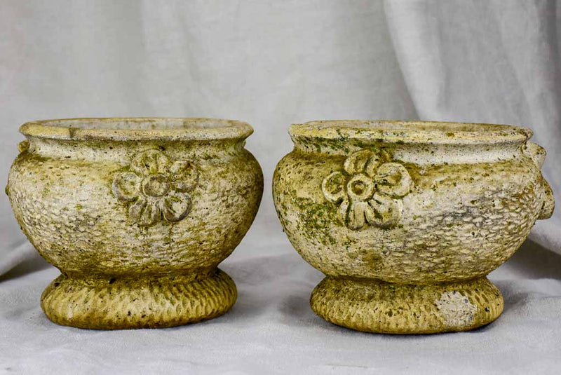 Pair of concrete flower pots decorated with pomegranates