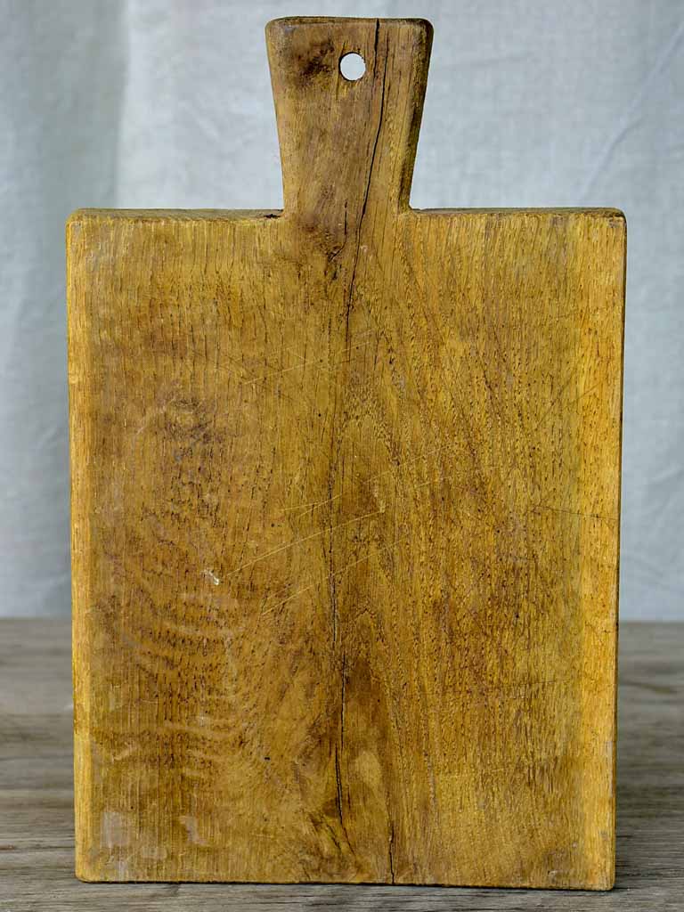 Small antique French cutting board with repairs