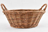 Aged French wicker basket with handles