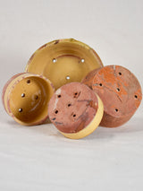 Collection of four antique French terracotta cheese strainers