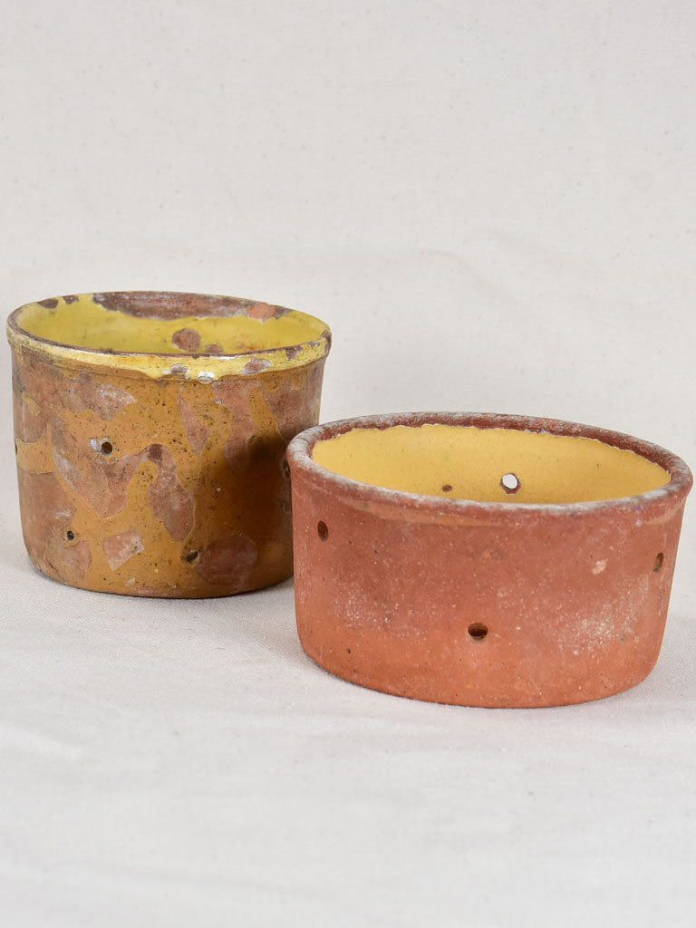 Two antique French terracotta cheese strainers