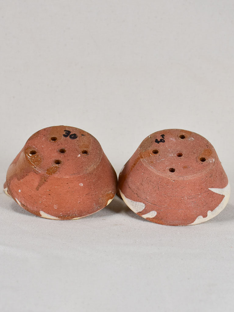 Collection of four small antique French terracotta cheese strainers
