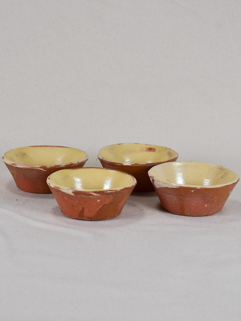 Collection of four small antique French terracotta cheese strainers