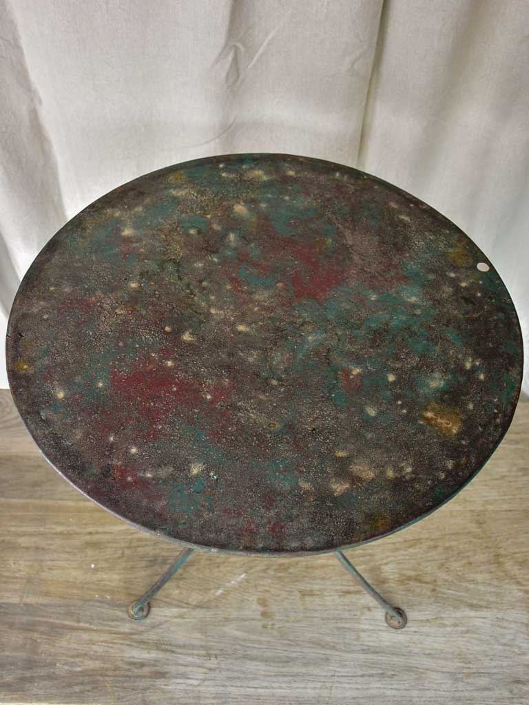 Round antique French garden table with green patina