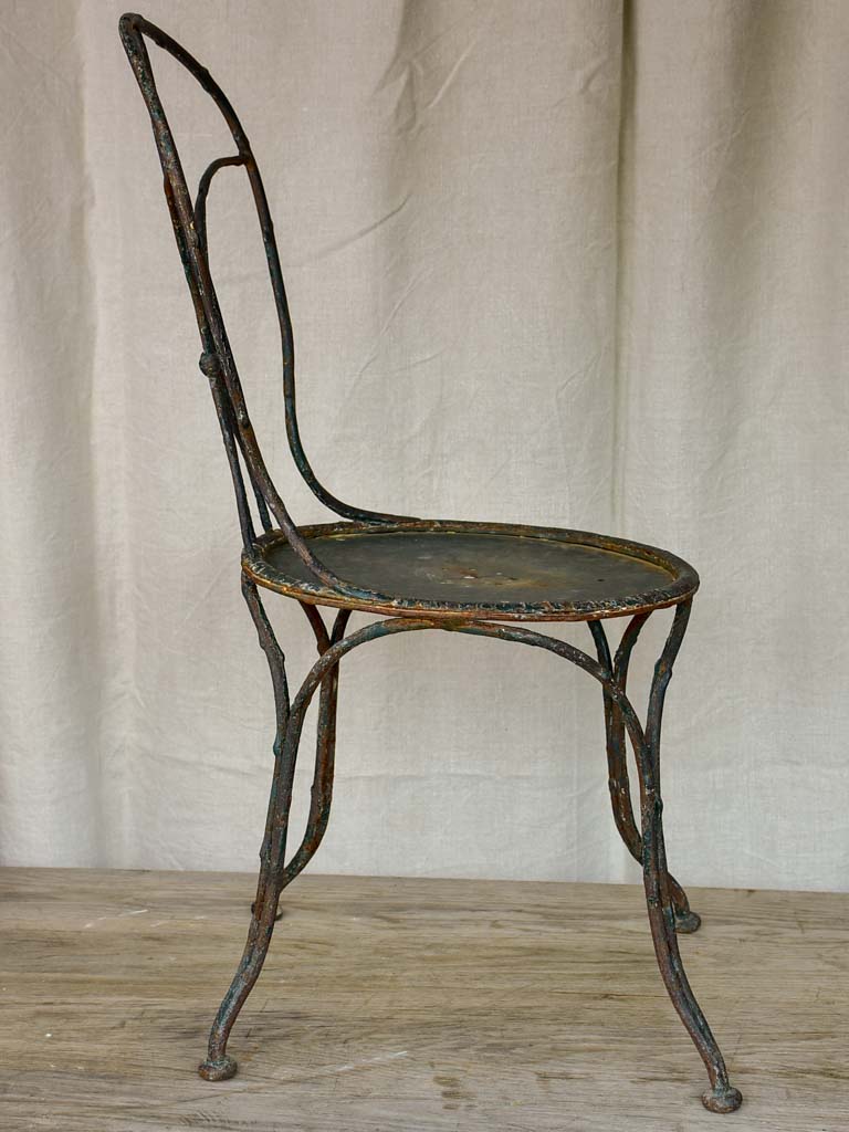 Antique French garden chair with branch - like back