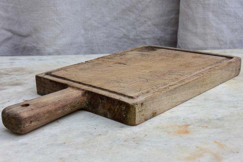 Small antique French cutting board with catchment gutter