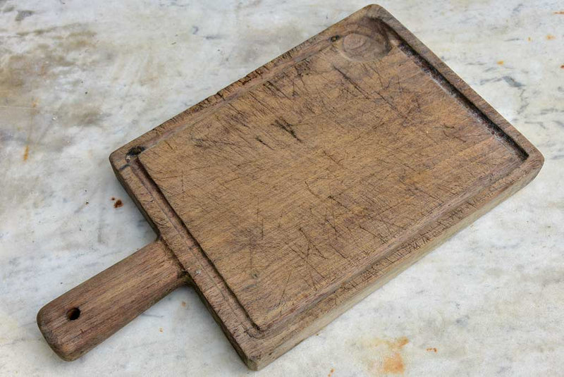 Small antique French cutting board with catchment gutter