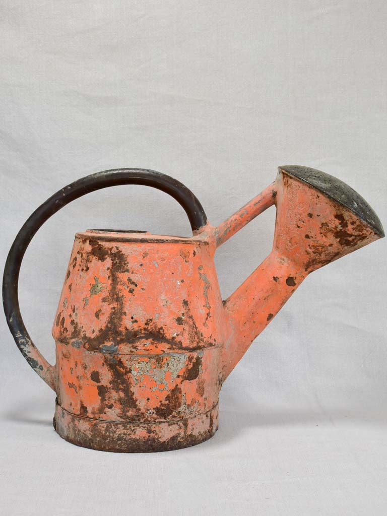 Nineteenth-century French watering can with orange patina