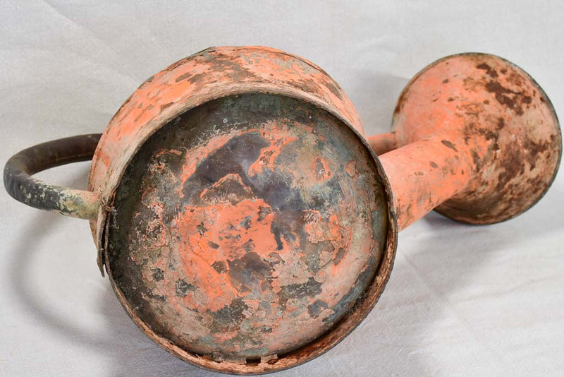 Nineteenth-century French watering can with orange patina