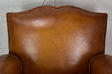 Large 1950's French leather club chair with mustache back and barrel arms