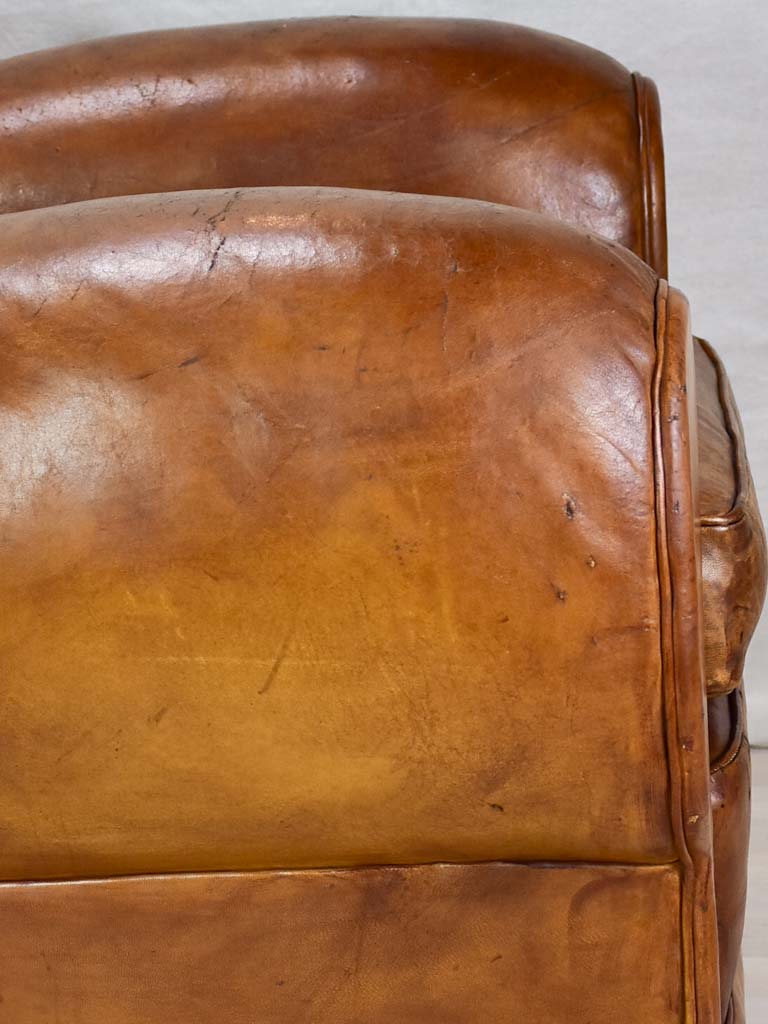Large 1950's French leather club chair with mustache back and barrel arms