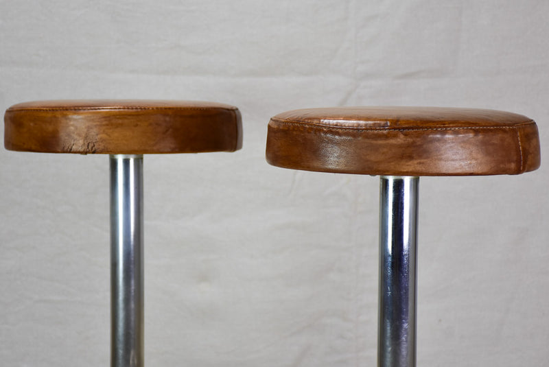 Pair of vintage French bar stools with leather seats 33¾"