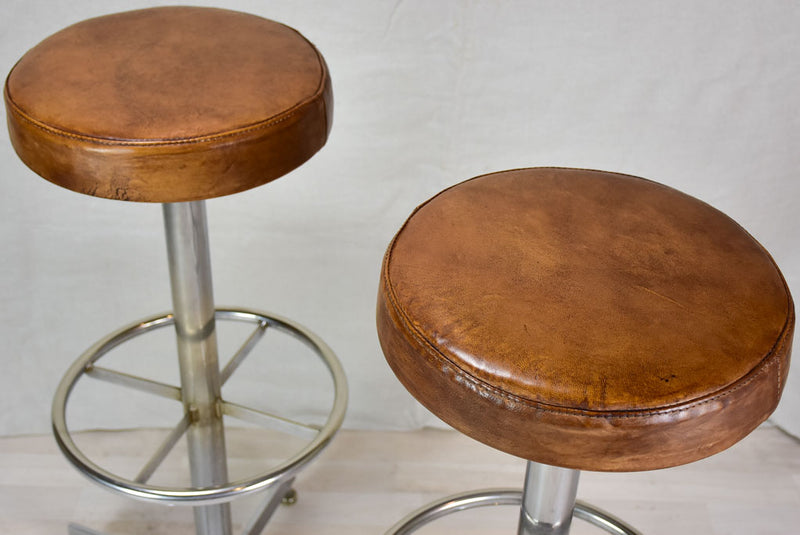 Pair of vintage French bar stools with leather seats 33¾"