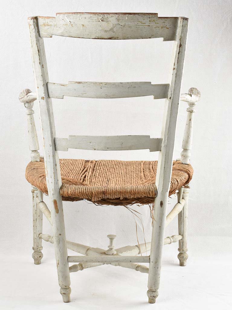 Aged French country armchair