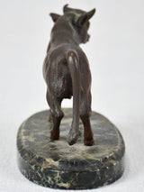 Small bronze statue of a bull on marble base
